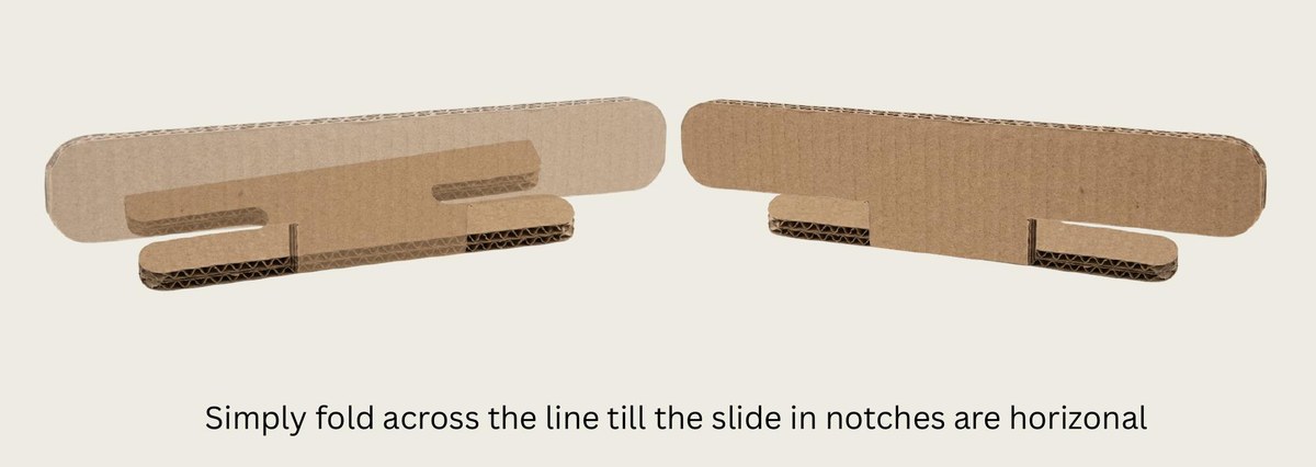 Two hand-cut cardboard Slide Stopper prototypes, folded